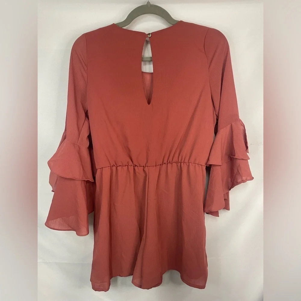 GB girls romper. Beautiful bell sleeves and a key hole back, it’s lined!